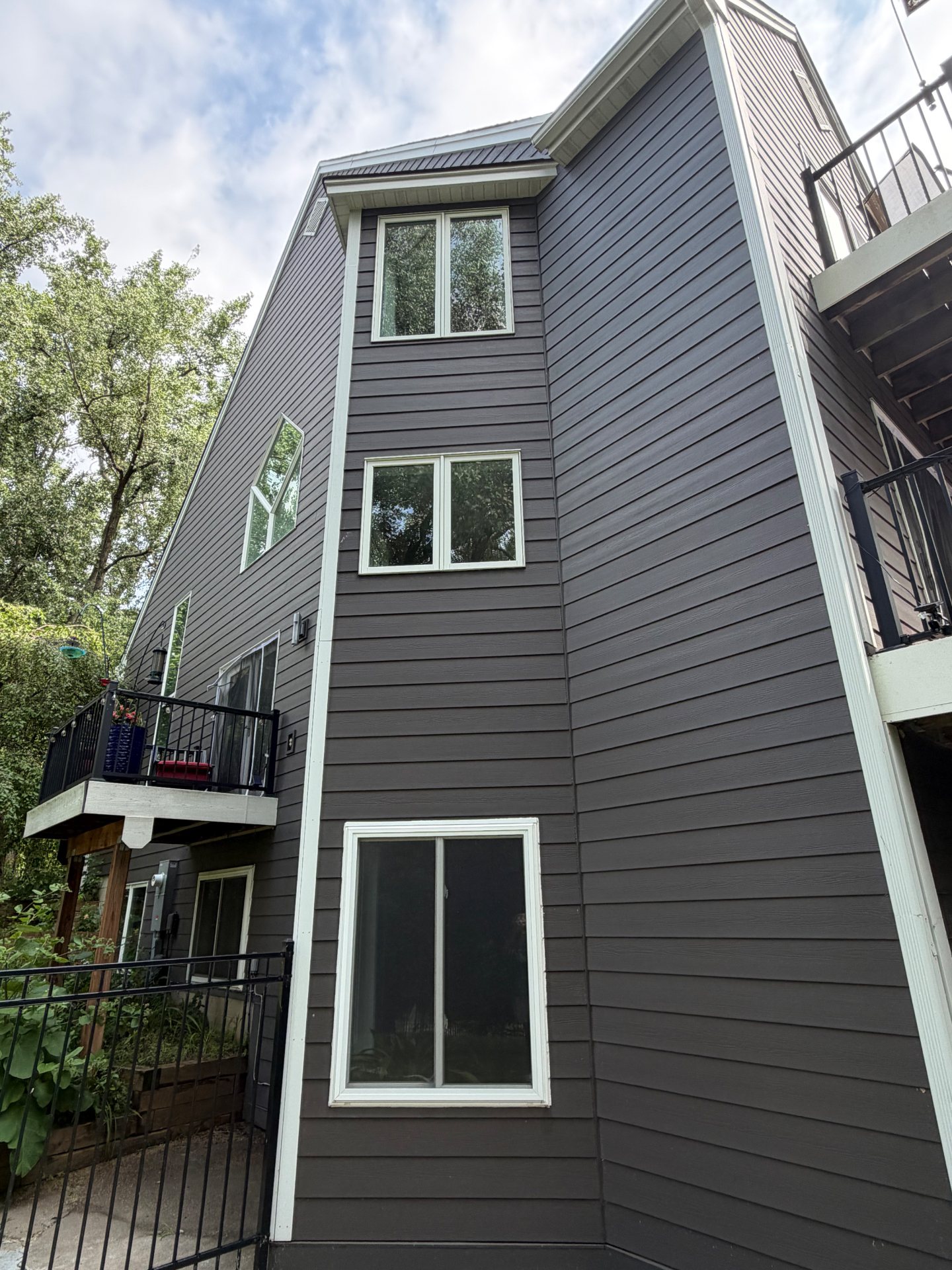 Modern home exterior with crystal-clear upper windows